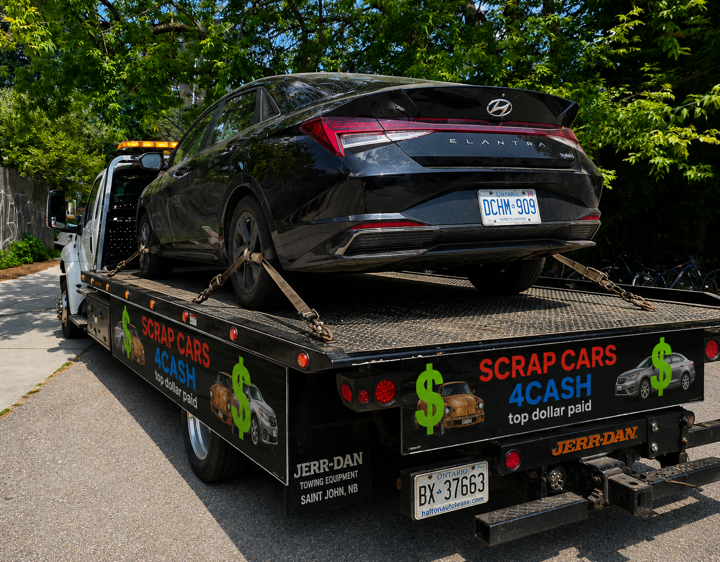 Scrap Cars 4 Cash flatbed tow truck removing a scrap car in Markham Ontario York Region